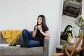 files/woman-cradles-coffee-on-a-sofa.jpg